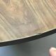 Mid-century round tulip dining table with a wooden top, vintage 1970s design.