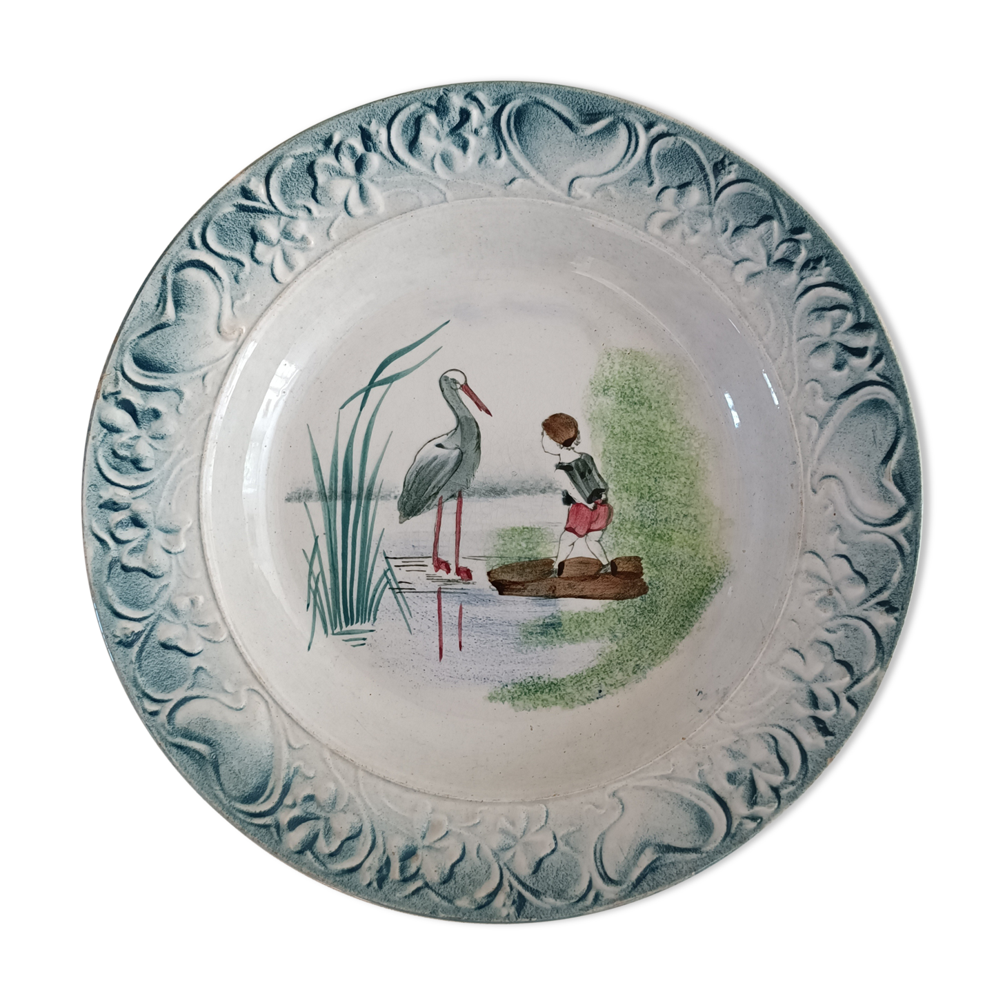 Serving dish iron earth decorated with child and stork decoration