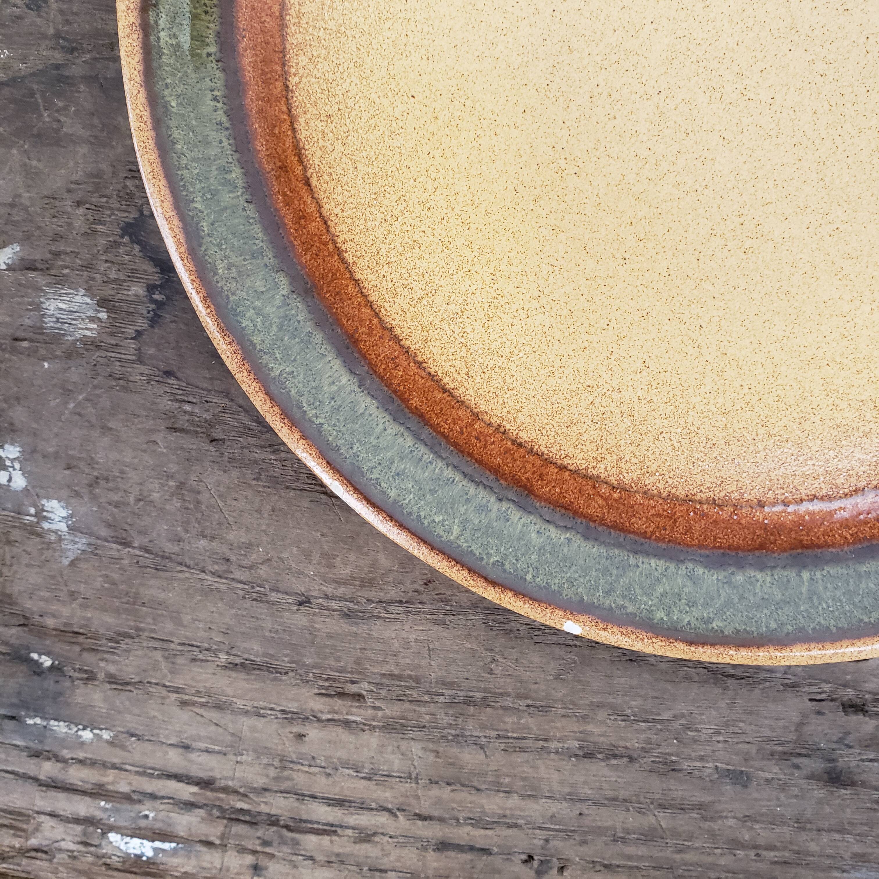 8 flat stoneware plates