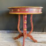 Pedestal table in polychrome wood and gold metal veneer