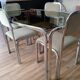 Table and 4 70s chairs chrome base and smoked glass tray chairs green water fabric