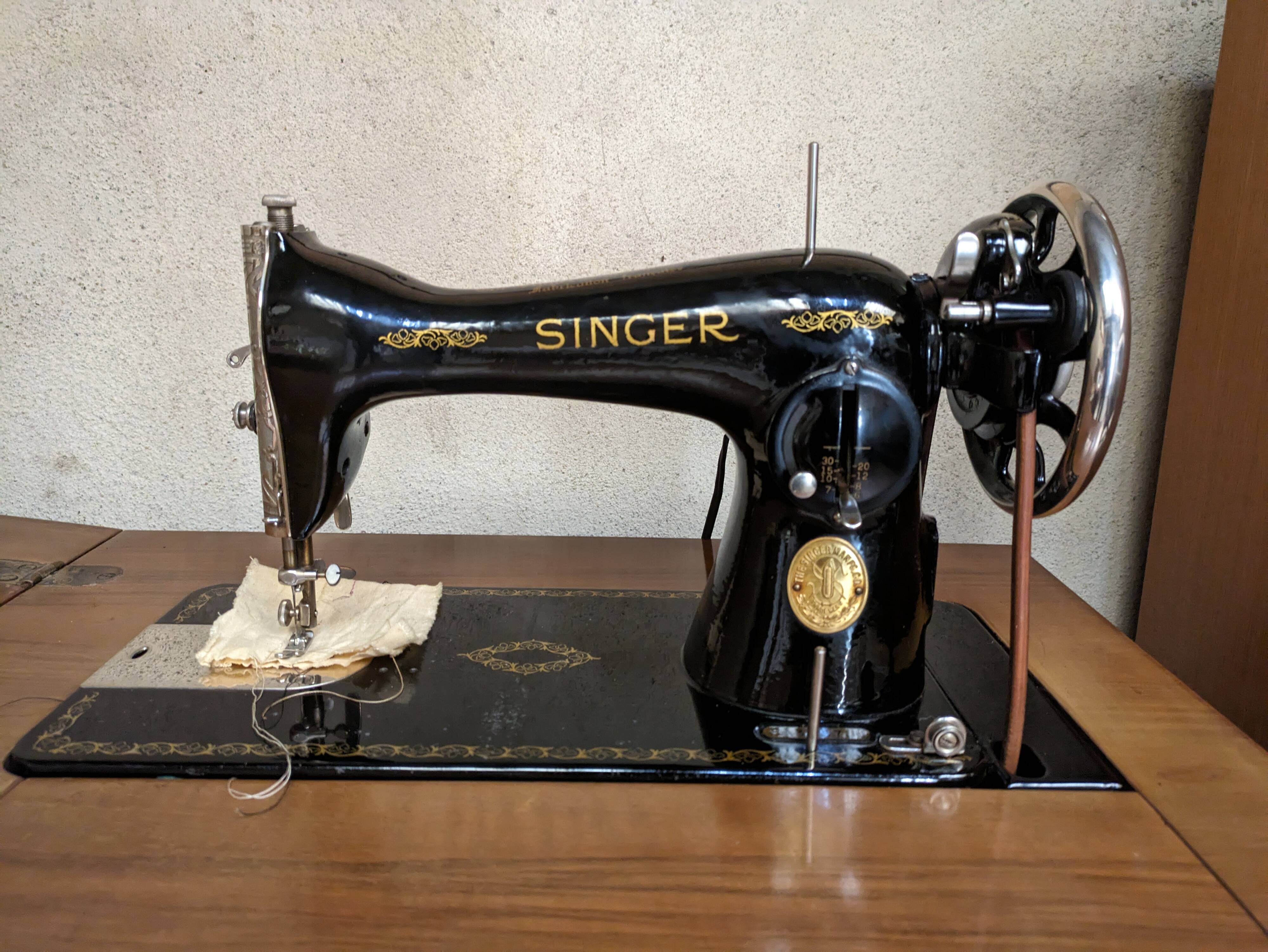 Singer sewing machine in its cabinet