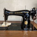 Singer sewing machine in its cabinet