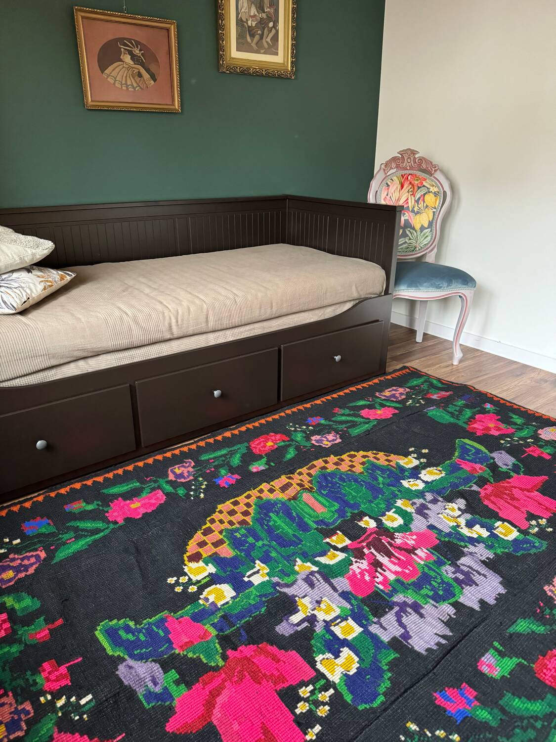 Romanian black wool carpet with a basket of colorful flowers