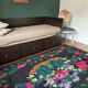 Romanian black wool carpet with a basket of colorful flowers