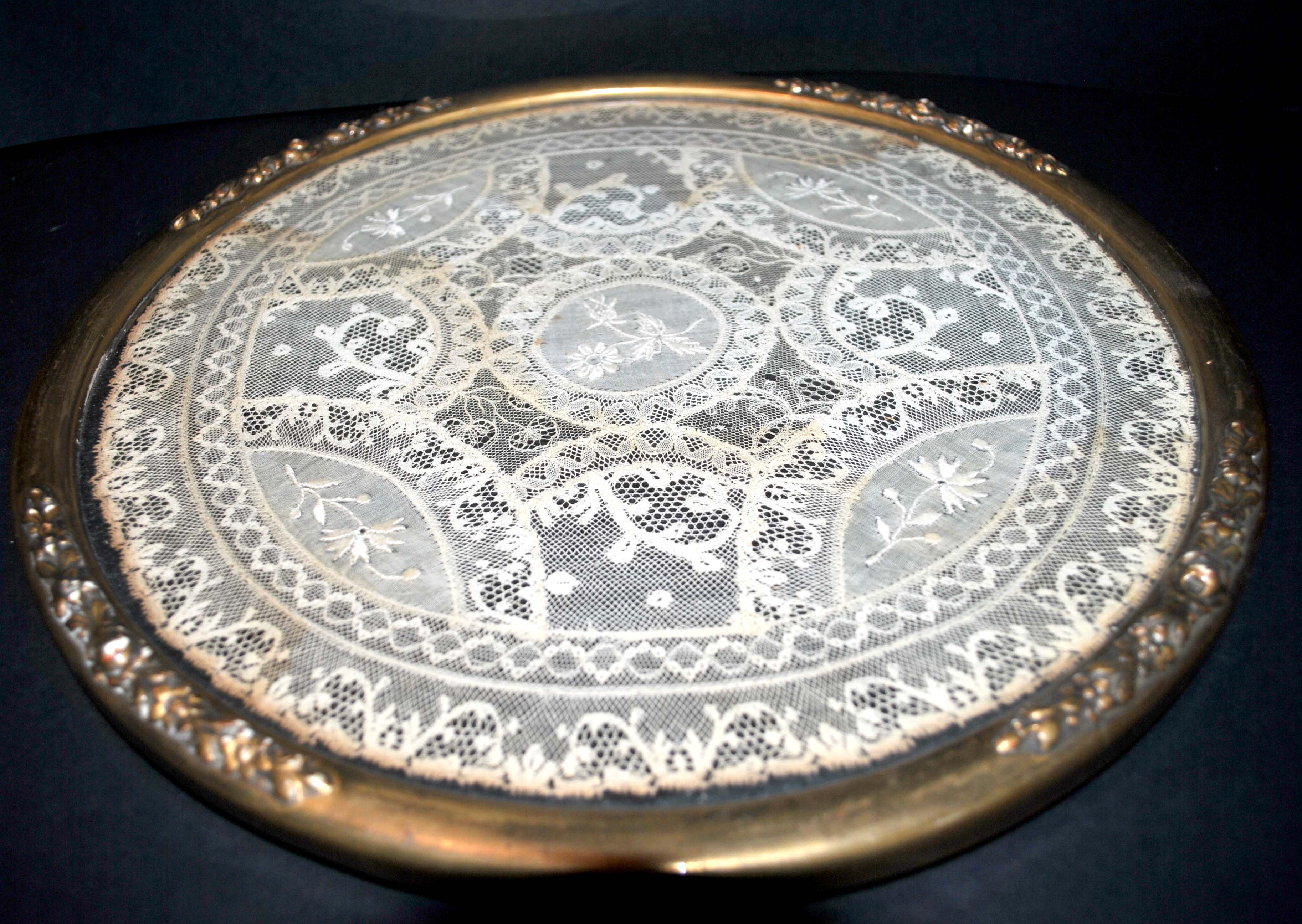 Antique lace top under glass and gilded stucco frame