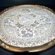 Antique lace top under glass and gilded stucco frame