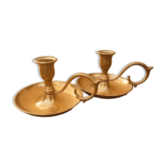 Duo of brass cellar rat candlesticks