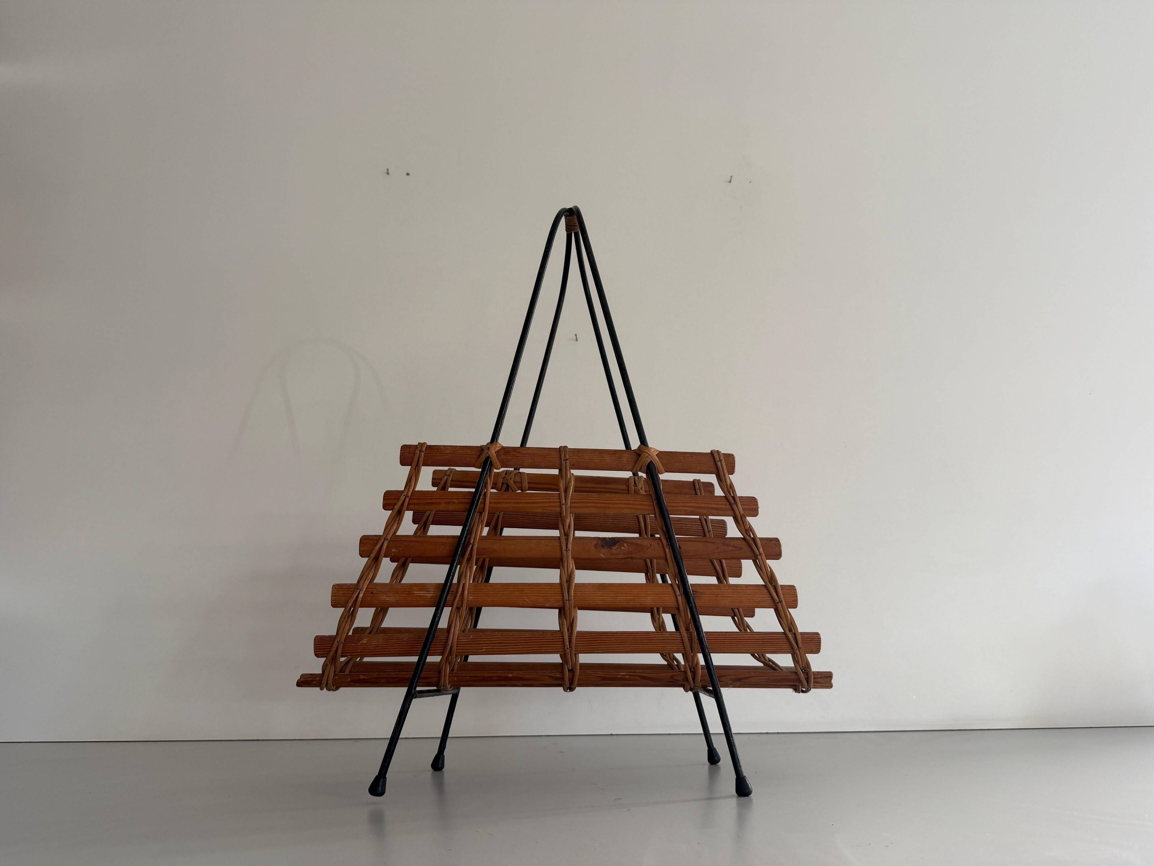 Mid-century black metal and wicker magazine rack, 1960, Germany