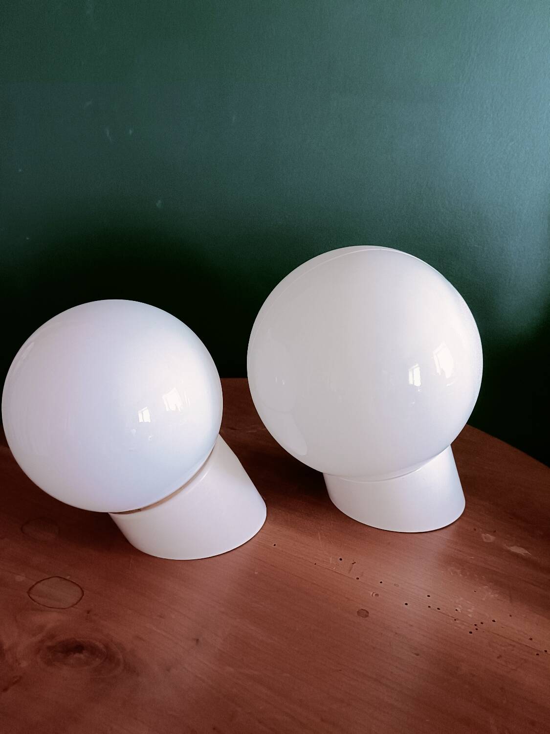 Two opaline glass globe wall lights