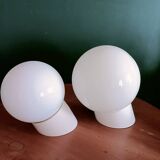 Two opaline glass globe wall lights