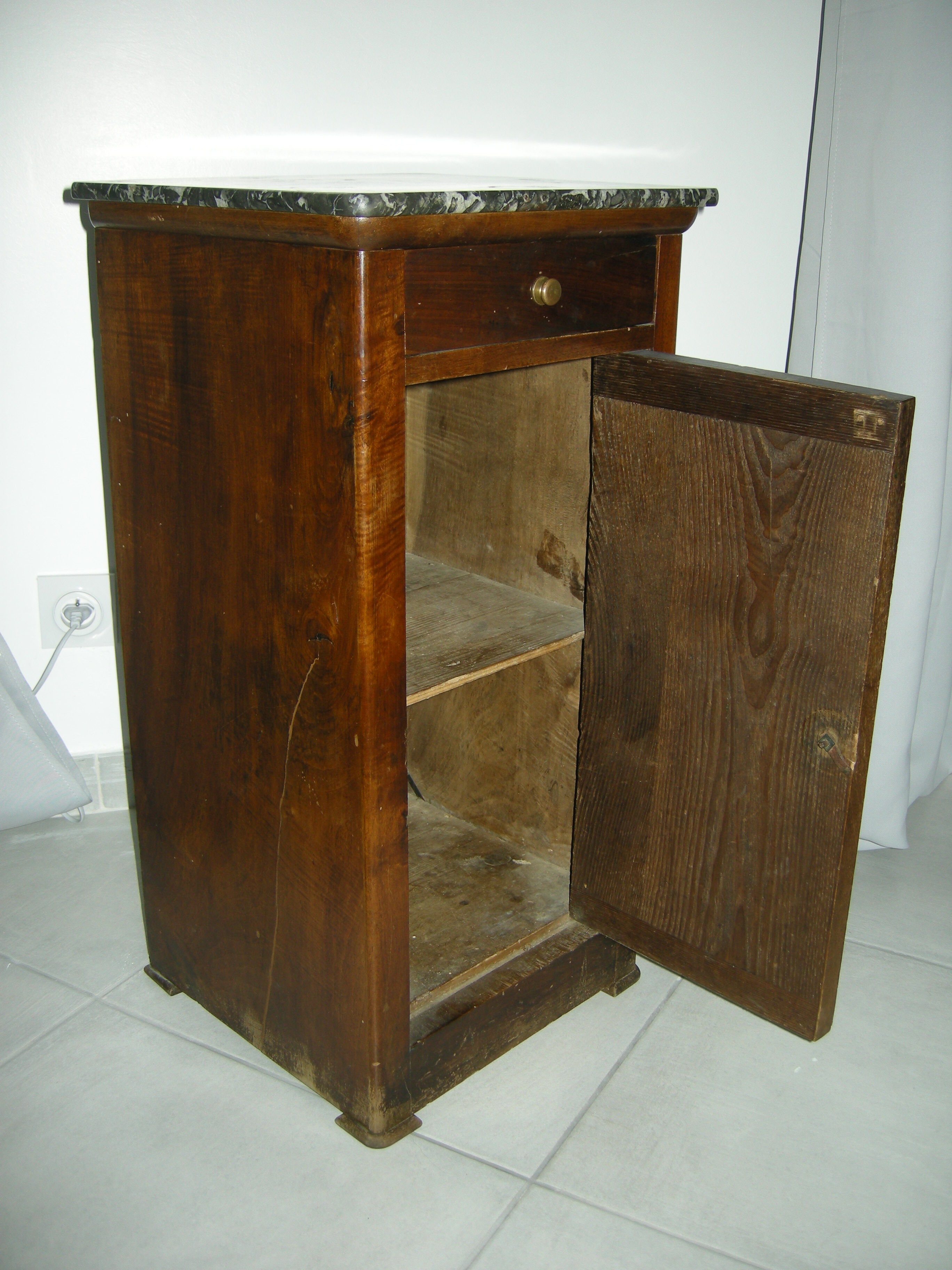 Walnut bedside table on marble