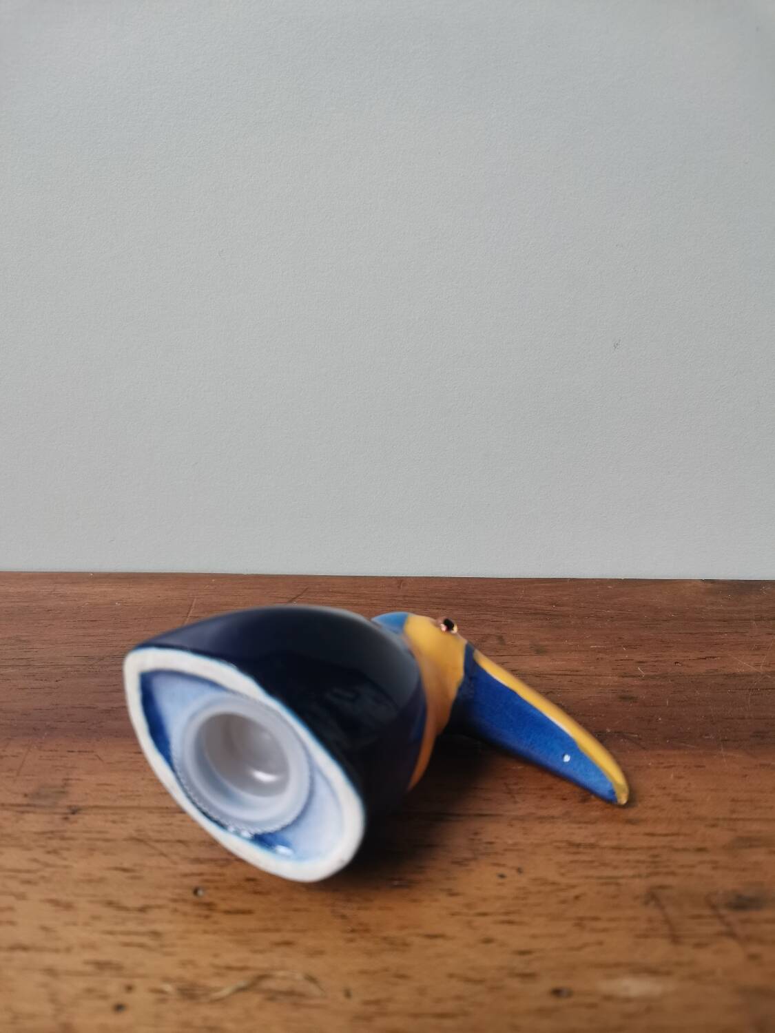 Vintage salt shaker in the shape of a toucan bird slip