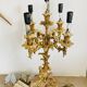 Pair of gilt bronze chandeliers, marble bases.