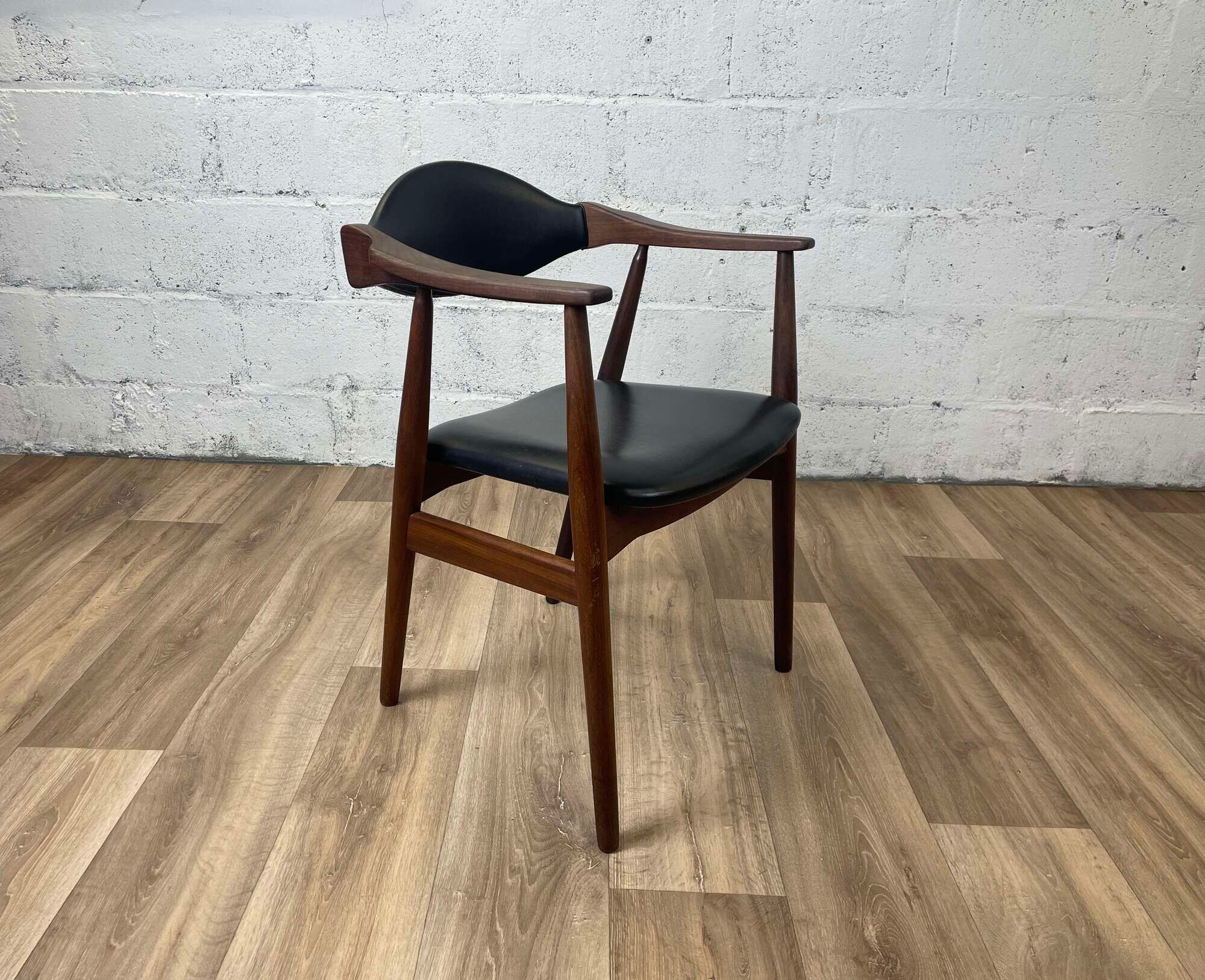 Vintage Scandinavian armchair in teak and black skai, 60s
