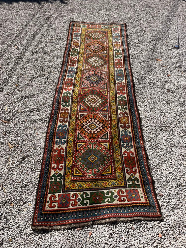 Long antique Persian carpet