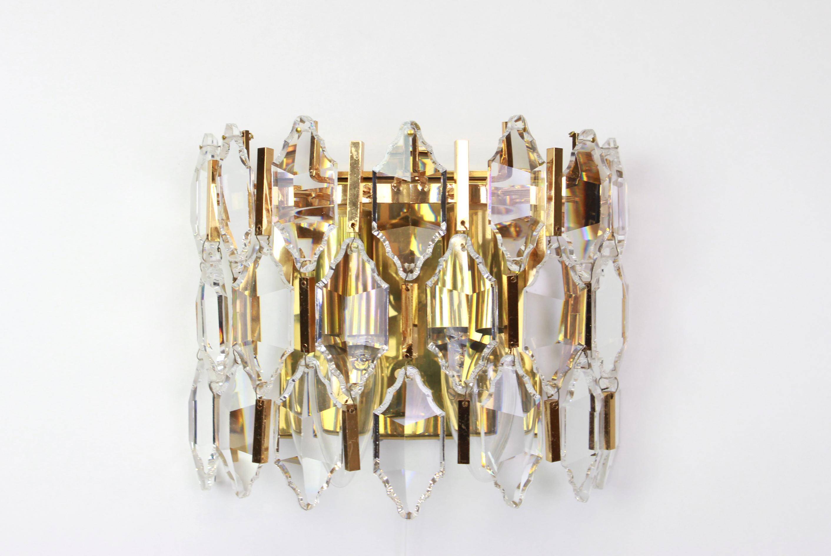 Pair of wall sconces in gilded brass and crystal by Palwa, Germany, 1970s.