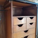 Old black wardrobe - wooden drawers and labels of origin