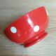 Red bowl with white polka dots signed Longchamp Porcelaine France