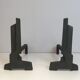 Pair of modernist chenets in cast iron and iron