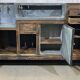 Early 20th-century oak bar counter with period zinc and tin cladding.