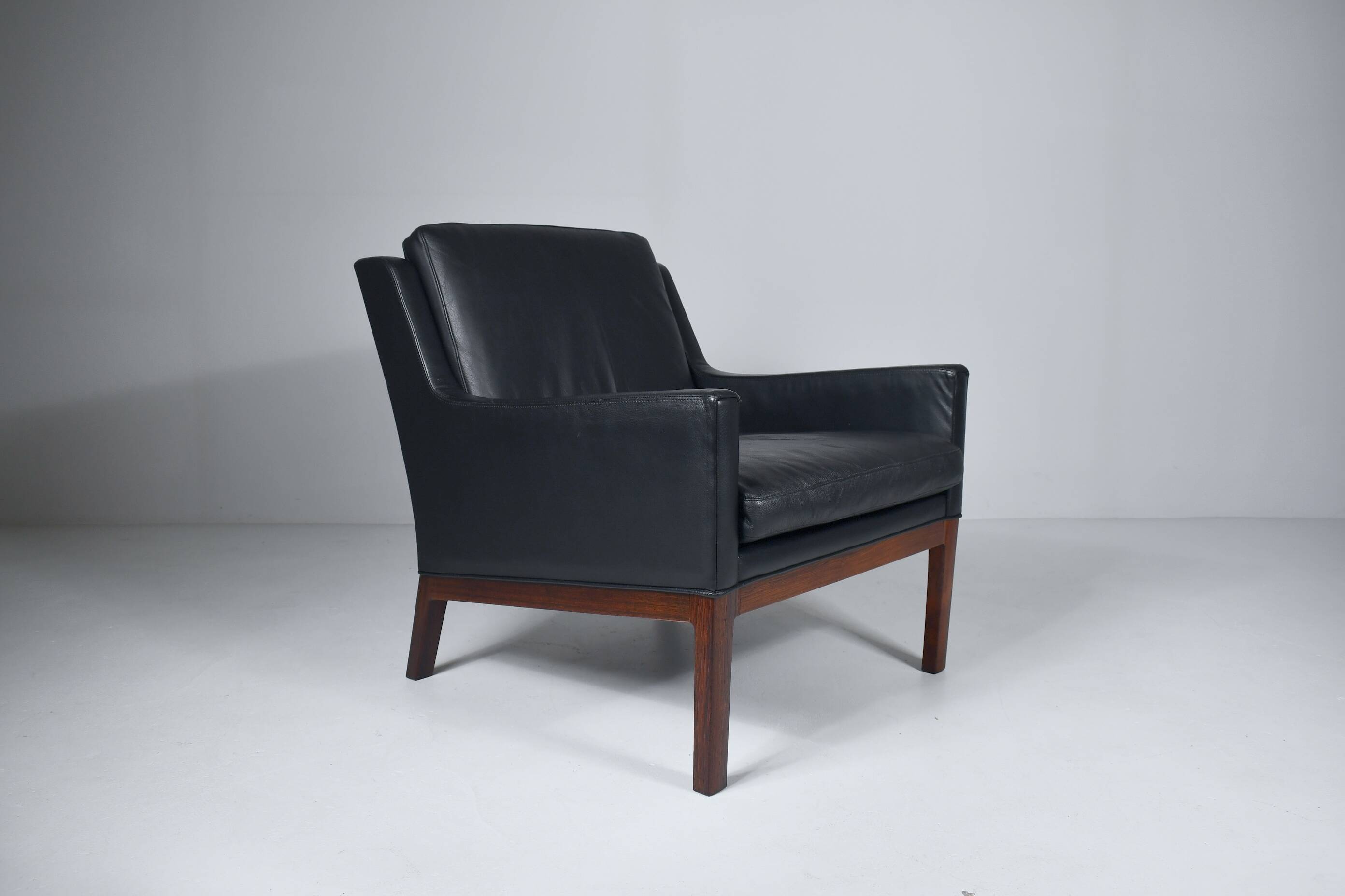 Leather and rosewood armchair by Kai lyngfeldt-Larsen. Denmark