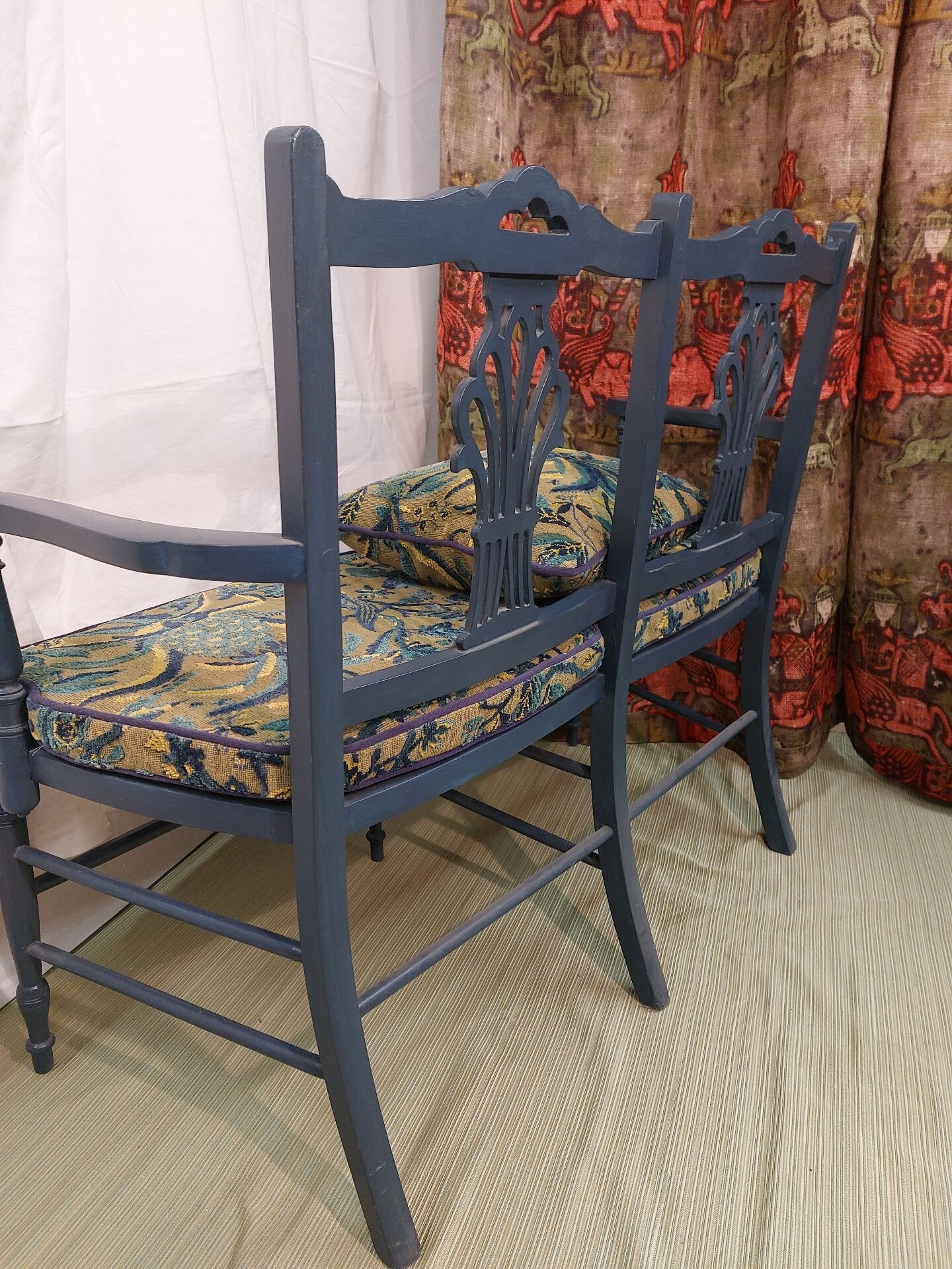 Pretty painted and upholstered bench in green and blue.
