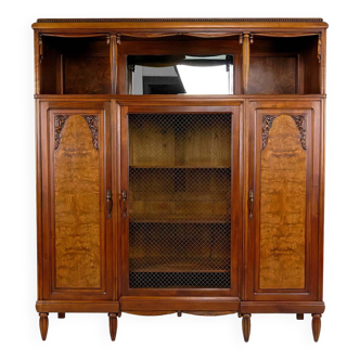 Art Deco showcase bookcase in carved walnut, France, circa 1925