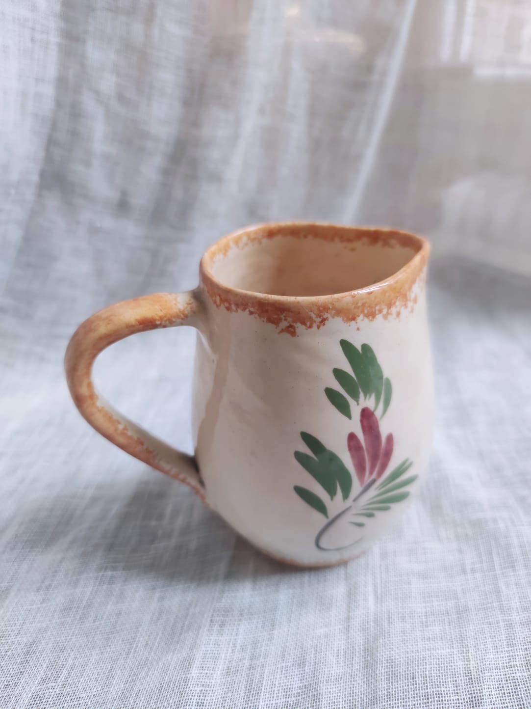 Small hand-painted pitcher