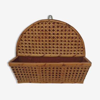 Old mail rack in wood and honey-colored rattan