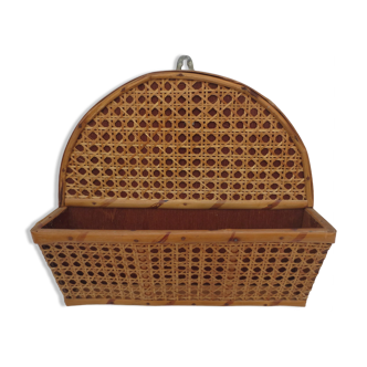 Old mail rack in wood and honey-colored rattan