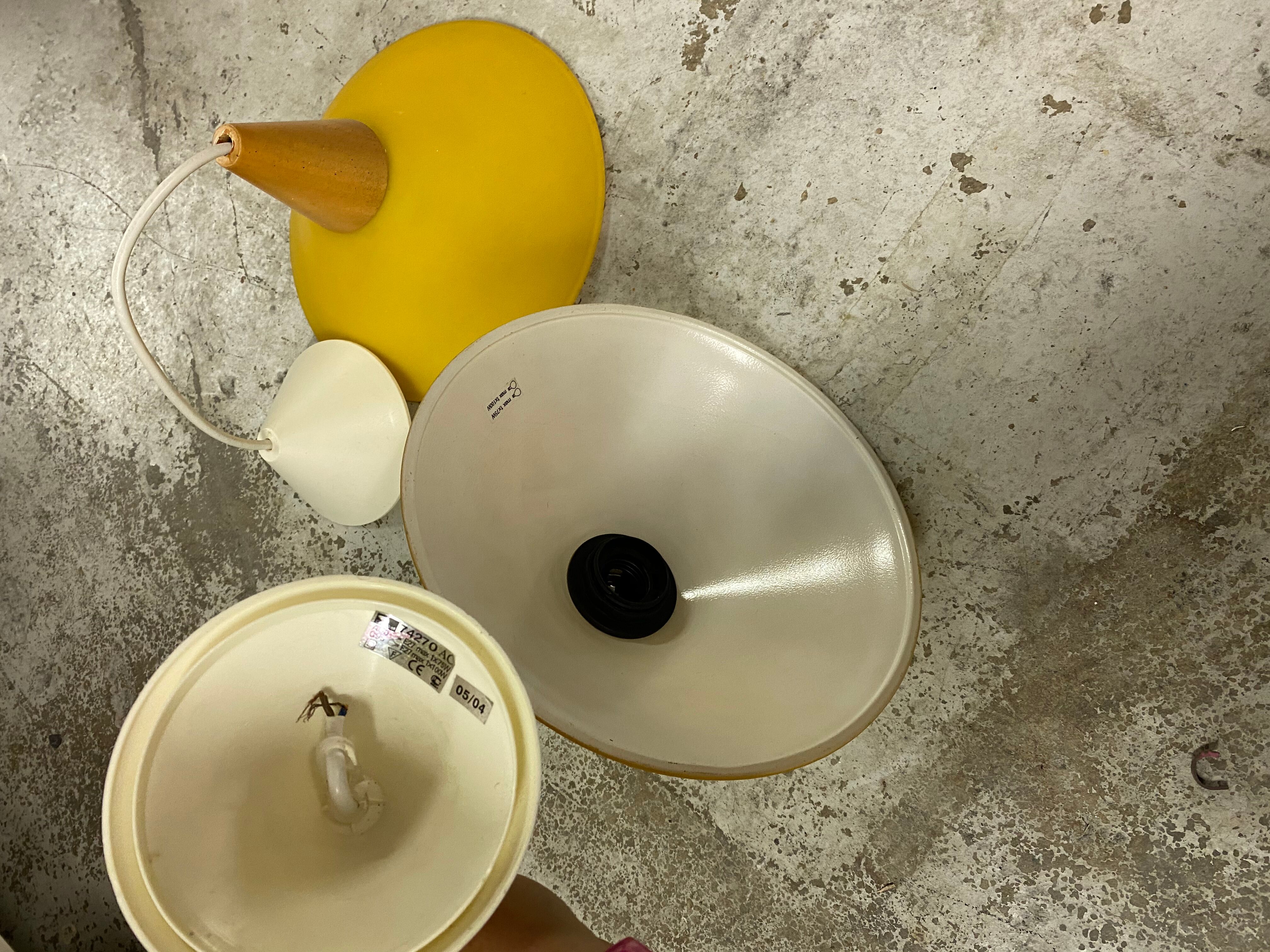 Duo of yellow glass pendant lamps