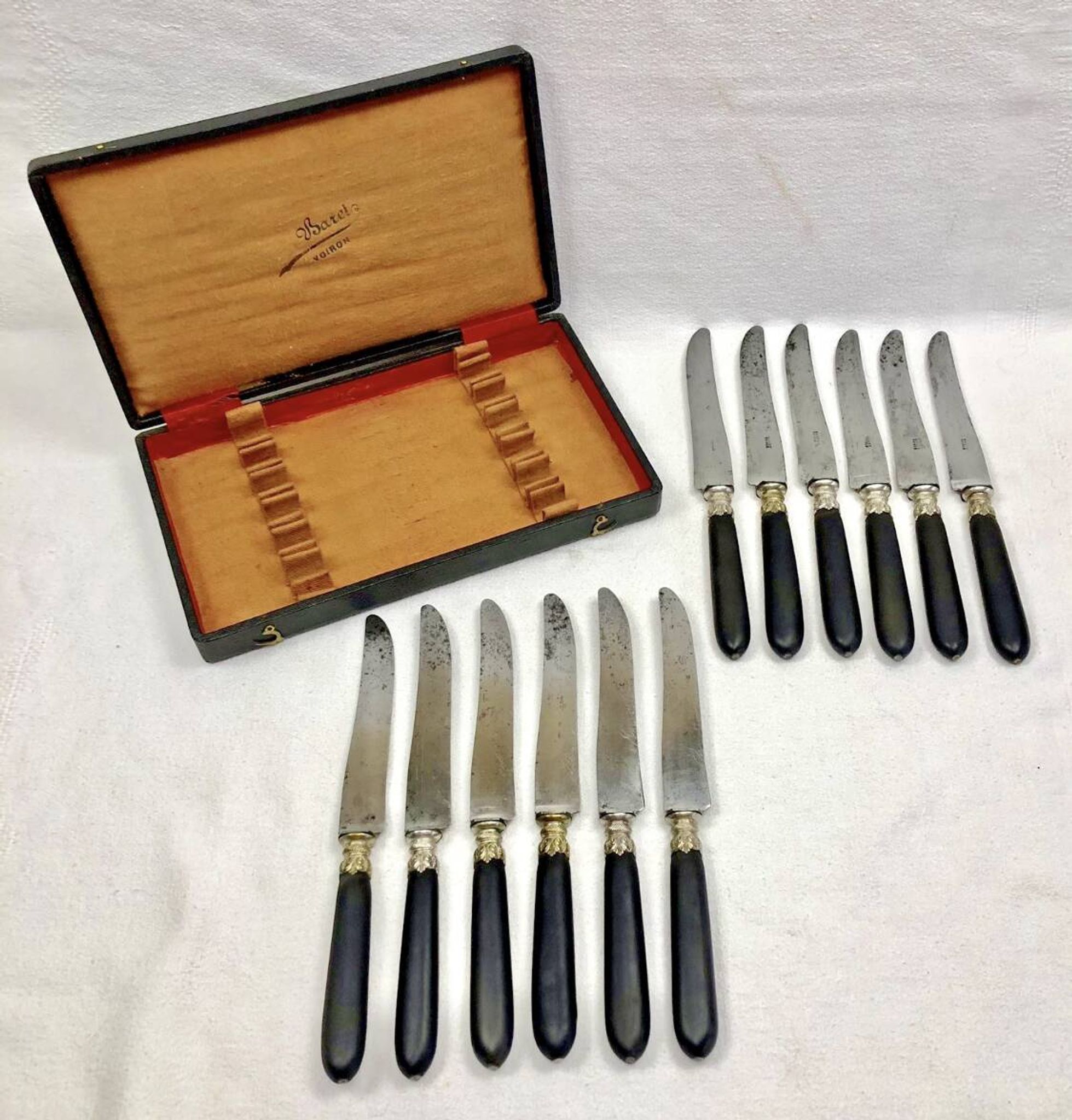 12 antique large table knives with ebony handles from the Napoleonic III period.