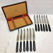 12 antique large table knives with ebony handles from the Napoleonic III period.