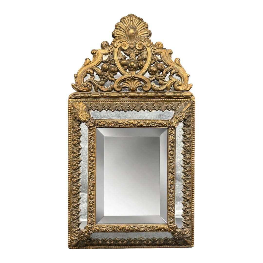 Small mirror with brass parcloses in repoussé style Louis XIV, late 19th century.