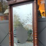 Old large carved wooden mirror