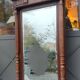Old large carved wooden mirror