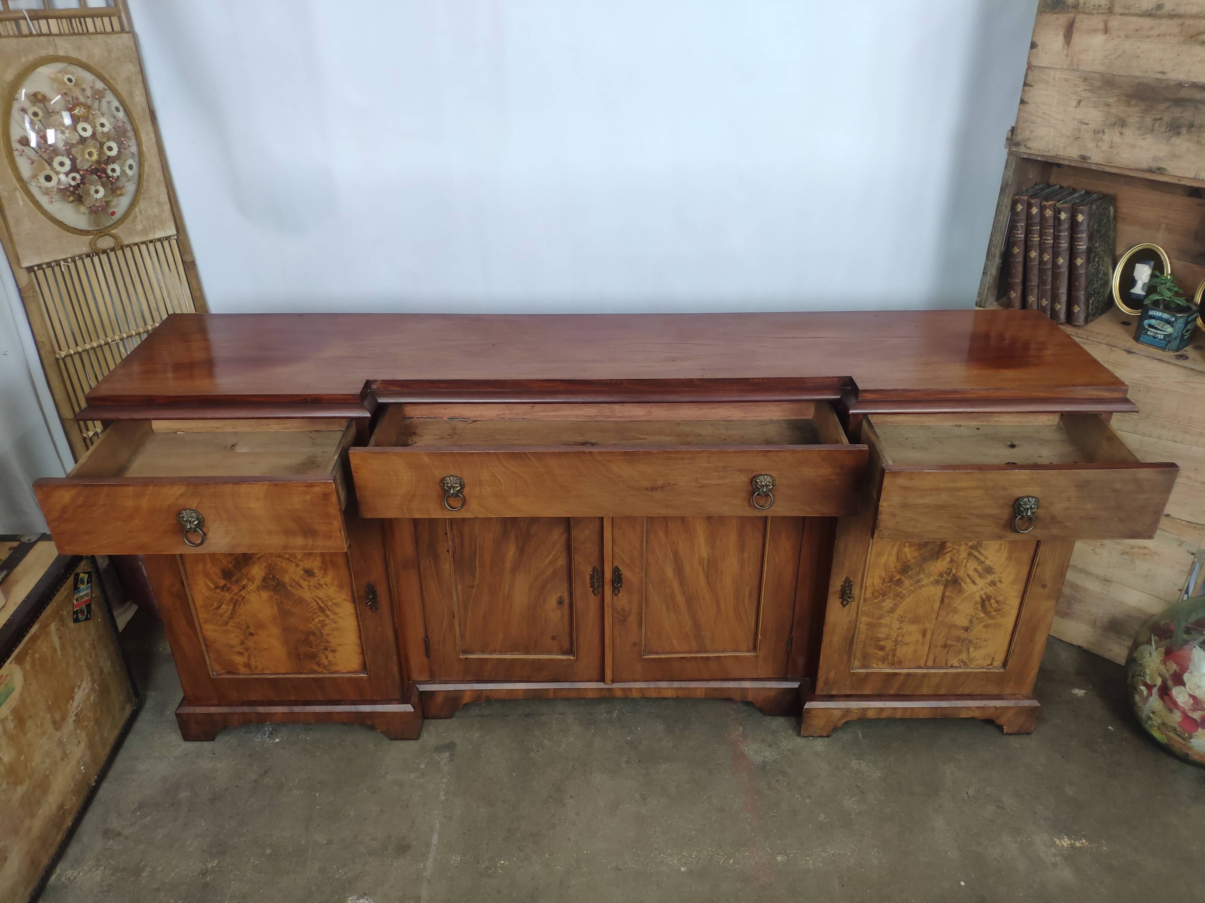 Walnut 4-door lion head sideboard