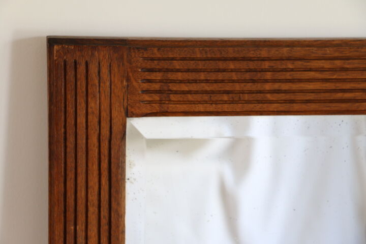 Beveled mirror grooved wood