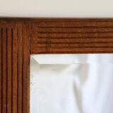 Beveled mirror grooved wood
