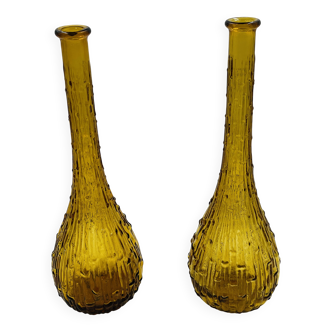 Set of two vintage textured amber glass Empoli bottles.