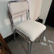 Pair of chrome chairs upholstered in boucle fabric.