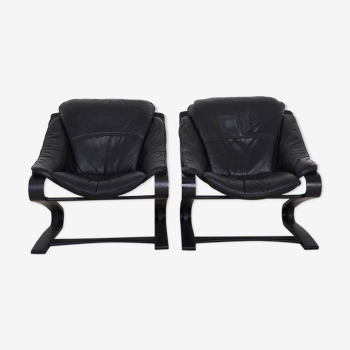 Paire de fauteuils en cuir noir, datant des années 70