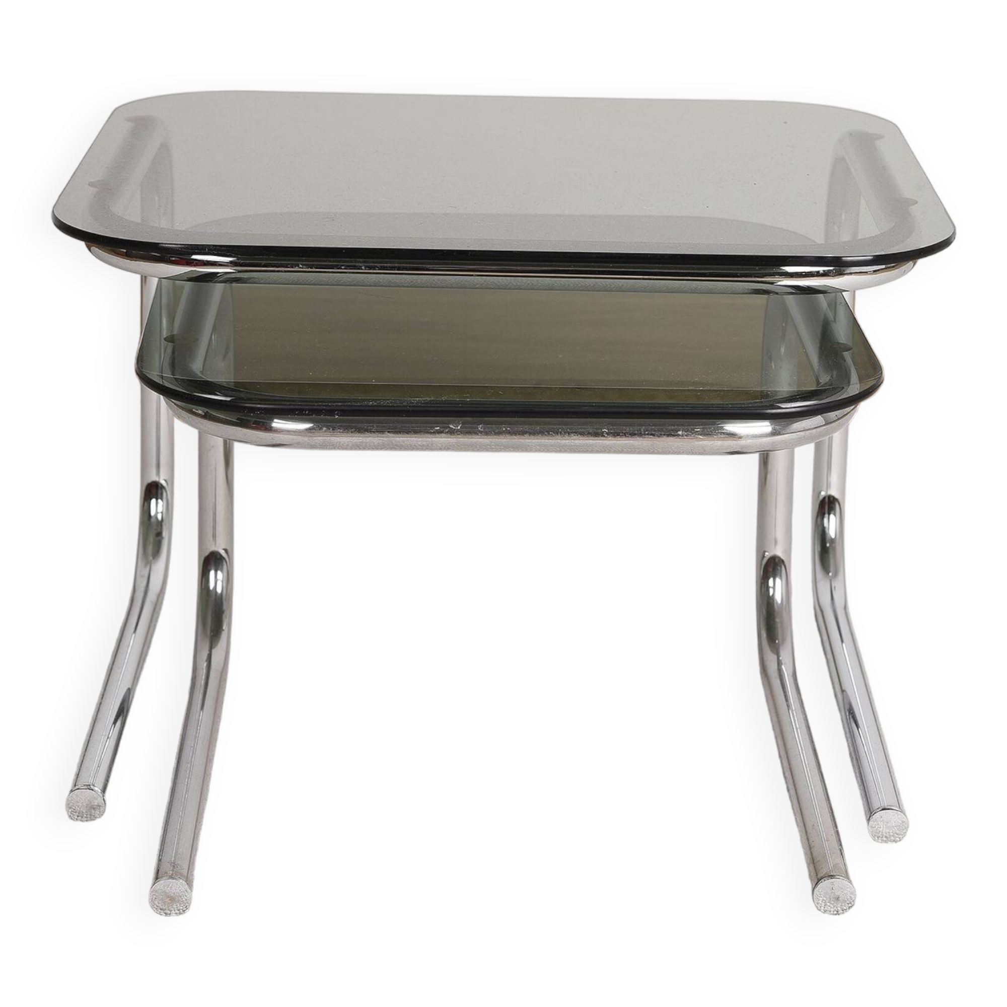 Pair of nesting tables in smoked glass and chrome legs.