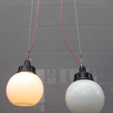 Trio of opal glass and bakelite globe pendant lights