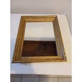 Wooden mirror and gold trim