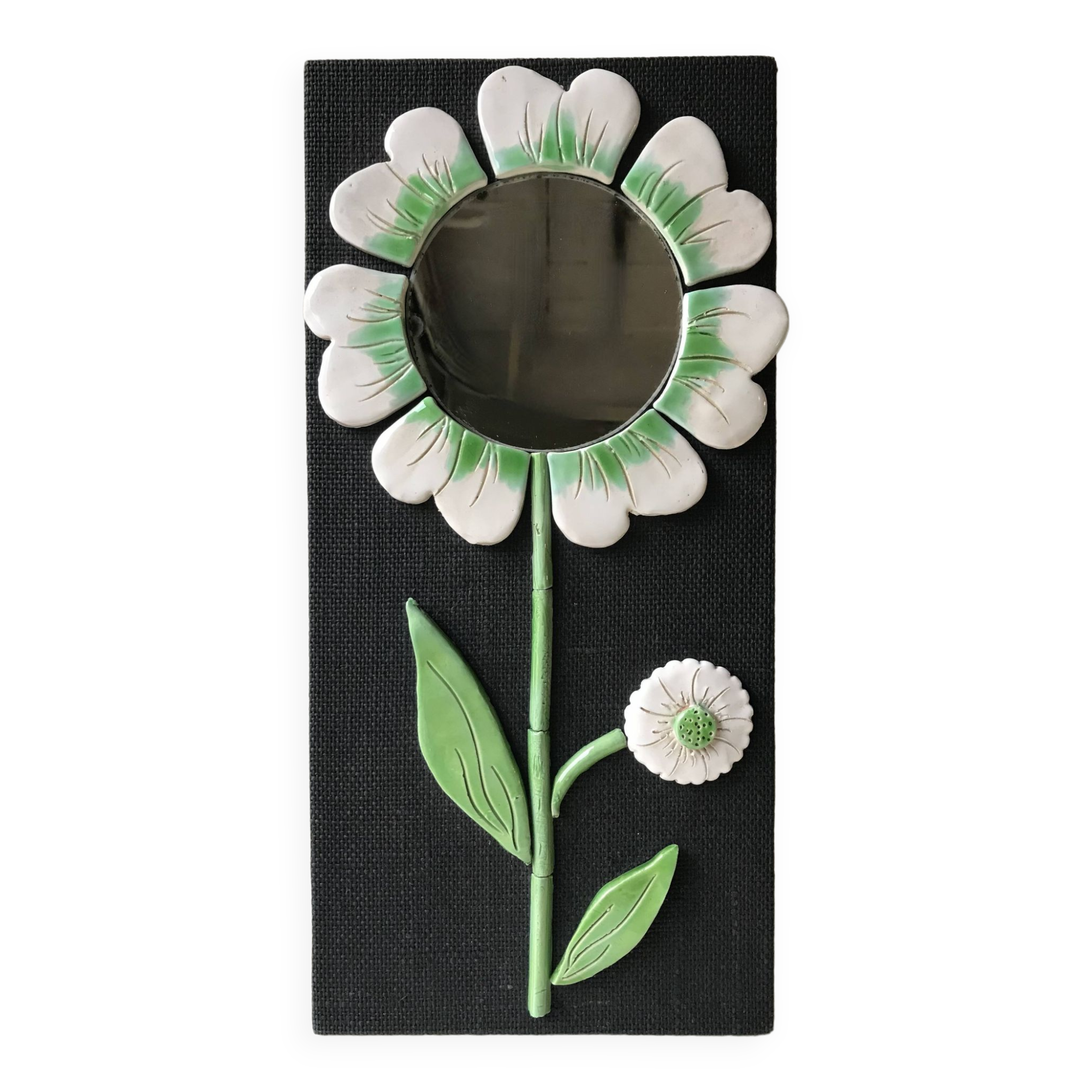 Ceramic flower mirror.