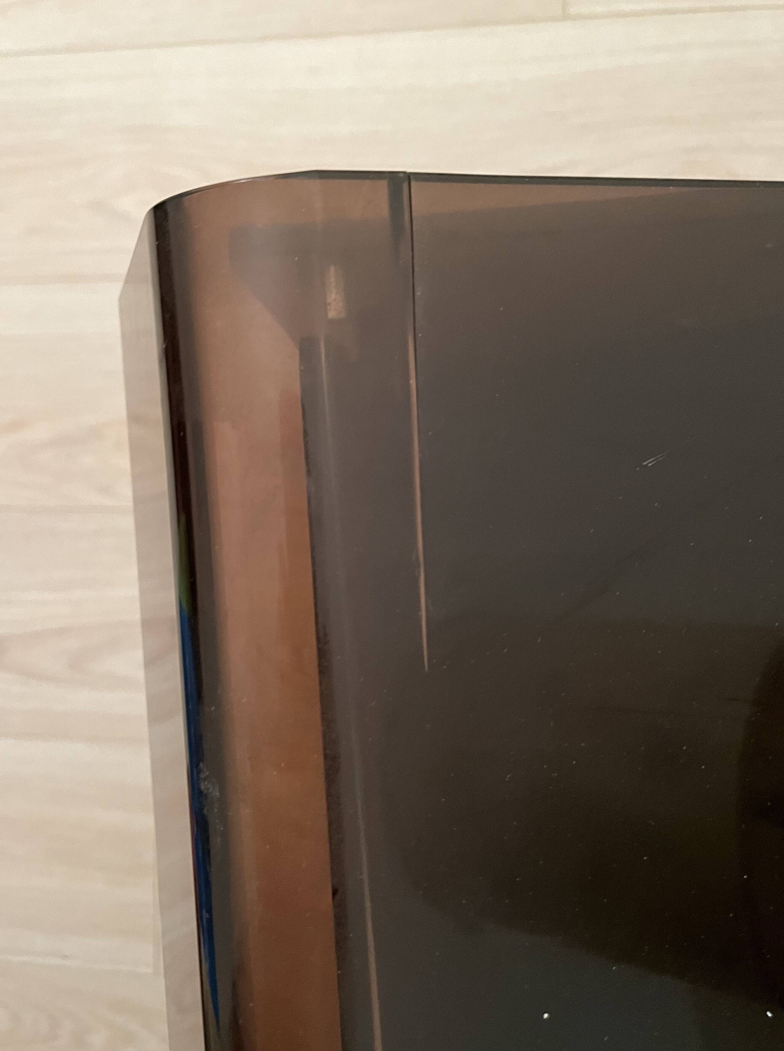 Modular bookcase in aluminum and smoked plexiglass