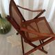 Fauteuil pliant en bambou, cannage, cuir et laiton
