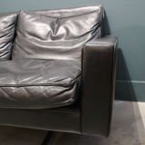 Leather sofa of the 70s footing in chrome